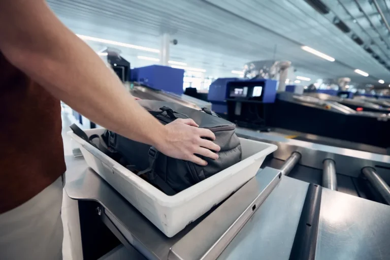 Why do I have to take out my laptop at airport check-in?